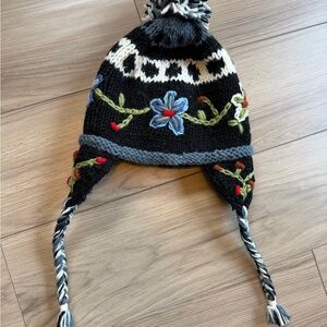 100% Wool outer. Handcrafted in Nepal. Earflap Embroidered Beanie - Black Floral